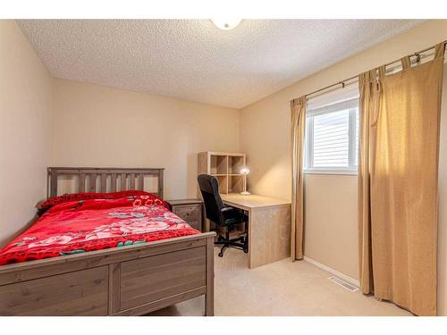 51 Arbour Butte Way Nw, Calgary, AB - Indoor Photo Showing Bedroom