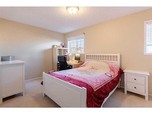 51 Arbour Butte Way Nw, Calgary, AB - Indoor Photo Showing Bedroom