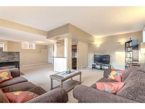 51 Arbour Butte Way Nw, Calgary, AB - Indoor Photo Showing Living Room