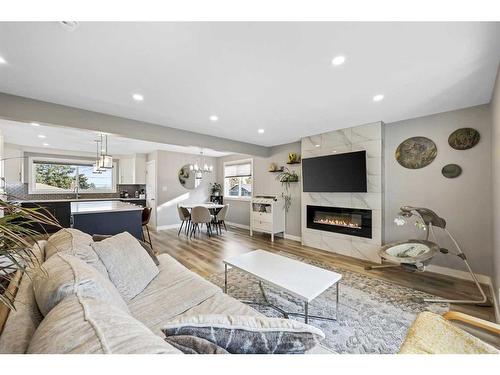 7128 Hunterwood Road Nw, Calgary, AB - Indoor Photo Showing Living Room With Fireplace