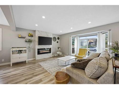 7128 Hunterwood Road Nw, Calgary, AB - Indoor Photo Showing Living Room With Fireplace