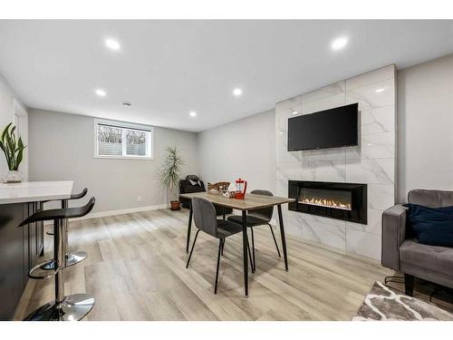 7128 Hunterwood Road Nw, Calgary, AB - Indoor With Fireplace