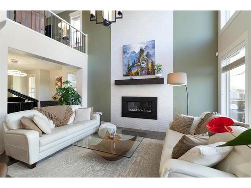 140 Auburn Sound Manor Se, Calgary, AB - Indoor Photo Showing Living Room With Fireplace