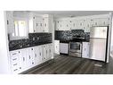 251 4 Street Nw, Sundre, AB  - Indoor Photo Showing Kitchen With Double Sink 