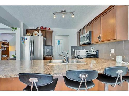 209 Windford Park Sw, Airdrie, AB - Indoor Photo Showing Kitchen With Stainless Steel Kitchen With Double Sink