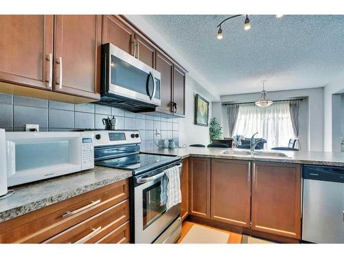 209 Windford Park Sw, Airdrie, AB - Indoor Photo Showing Kitchen With Stainless Steel Kitchen With Double Sink