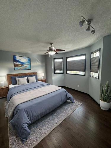 228 Sheep River Lane, Okotoks, AB - Indoor Photo Showing Bedroom