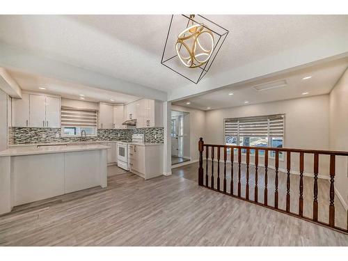 1131 Millcrest Rise Sw, Calgary, AB - Indoor Photo Showing Kitchen With Upgraded Kitchen