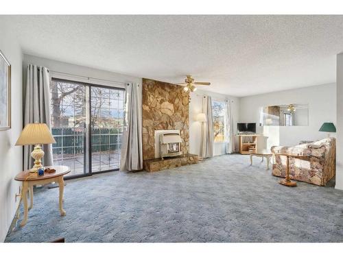 280 Midpark Gardens Se, Calgary, AB - Indoor Photo Showing Living Room With Fireplace