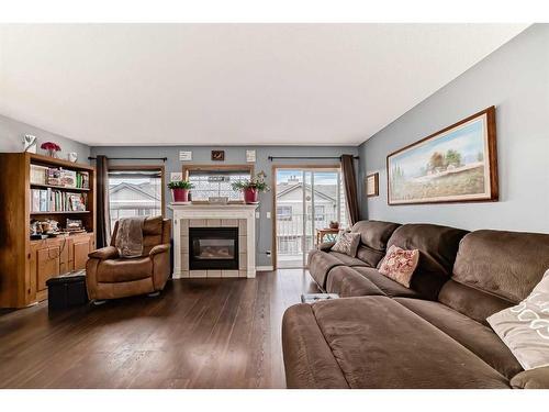 131 Millview Square Sw, Calgary, AB - Indoor Photo Showing Living Room With Fireplace