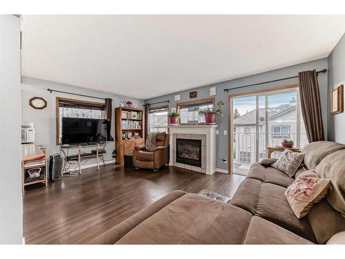 131 Millview Square Sw, Calgary, AB - Indoor Photo Showing Living Room With Fireplace