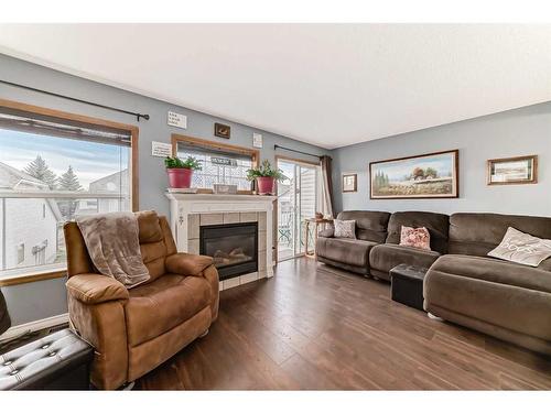 131 Millview Square Sw, Calgary, AB - Indoor Photo Showing Living Room With Fireplace