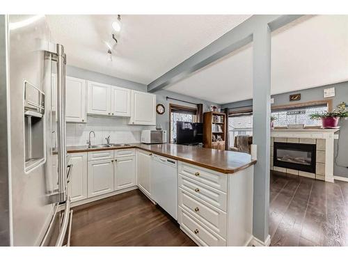 131 Millview Square Sw, Calgary, AB - Indoor Photo Showing Kitchen With Double Sink