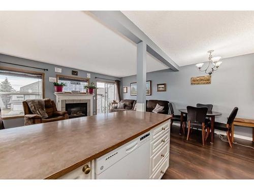 131 Millview Square Sw, Calgary, AB - Indoor With Fireplace