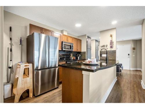 1-105 Village Heights Sw, Calgary, AB - Indoor Photo Showing Kitchen With Stainless Steel Kitchen