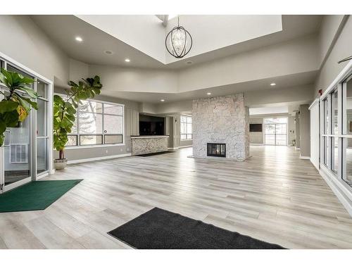 1-105 Village Heights Sw, Calgary, AB - Indoor With Fireplace