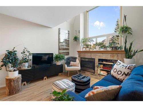 2-601 4Th Street, Canmore, AB - Indoor Photo Showing Living Room With Fireplace