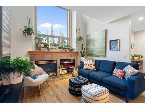 2-601 4Th Street, Canmore, AB - Indoor Photo Showing Living Room With Fireplace