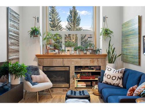 2-601 4Th Street, Canmore, AB - Indoor Photo Showing Living Room With Fireplace