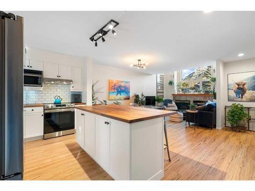 2-601 4Th Street, Canmore, AB - Indoor Photo Showing Kitchen With Double Sink