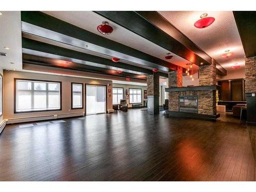 229-23 Millrise Drive Sw, Calgary, AB - Indoor With Fireplace