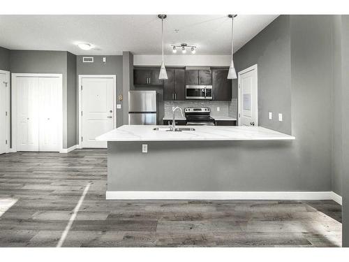 229-23 Millrise Drive Sw, Calgary, AB - Indoor Photo Showing Kitchen With Double Sink With Upgraded Kitchen