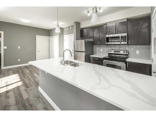 229-23 Millrise Drive Sw, Calgary, AB - Indoor Photo Showing Kitchen With Double Sink With Upgraded Kitchen