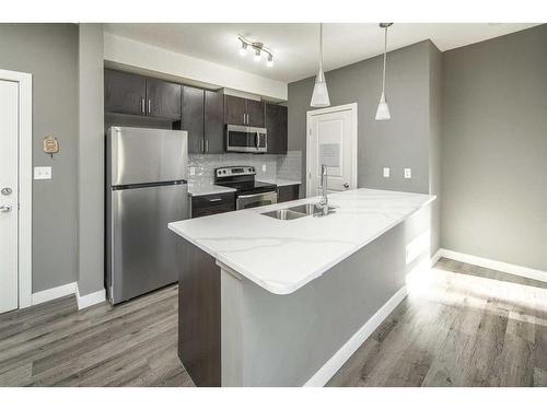 229-23 Millrise Drive Sw, Calgary, AB - Indoor Photo Showing Kitchen With Double Sink