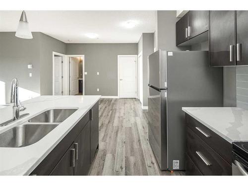 229-23 Millrise Drive Sw, Calgary, AB - Indoor Photo Showing Kitchen With Double Sink