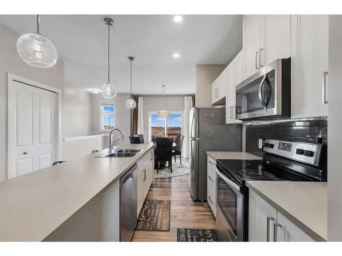 64 Copperstone Common Se, Calgary, AB - Indoor Photo Showing Kitchen With Double Sink With Upgraded Kitchen