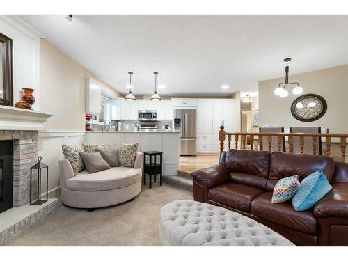 8 Shawnee Way Sw, Calgary, AB - Indoor Photo Showing Living Room With Fireplace