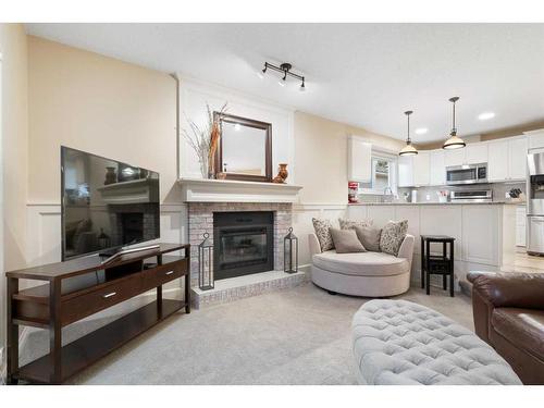 8 Shawnee Way Sw, Calgary, AB - Indoor Photo Showing Living Room With Fireplace