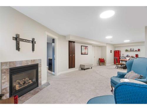 8 Shawnee Way Sw, Calgary, AB - Indoor With Fireplace