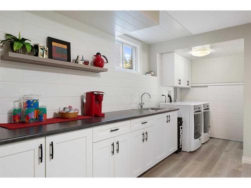 8 Shawnee Way Sw, Calgary, AB - Indoor Photo Showing Laundry Room