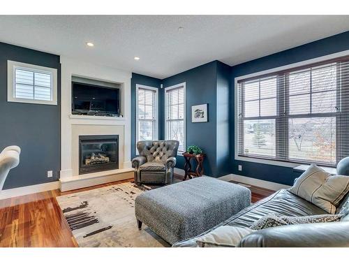 48 Amiens Crescent Sw, Calgary, AB - Indoor Photo Showing Living Room With Fireplace