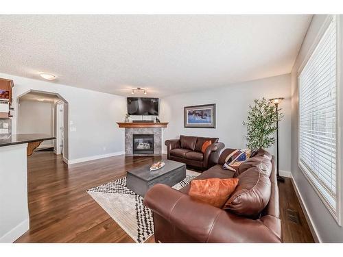 37 Everhollow Park Sw, Calgary, AB - Indoor Photo Showing Living Room With Fireplace