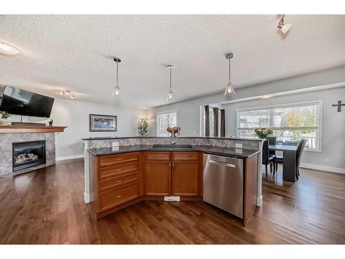 37 Everhollow Park Sw, Calgary, AB - Indoor Photo Showing Other Room With Fireplace