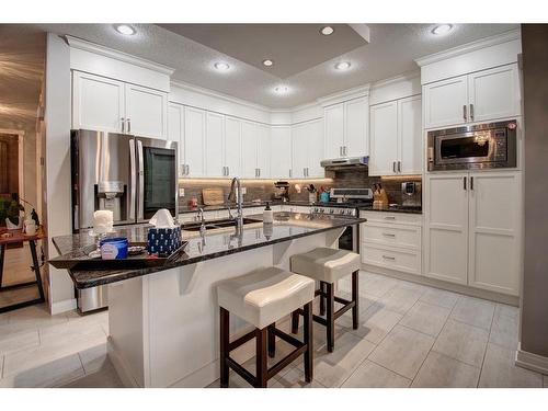 1186 Coopers Drive Sw, Airdrie, AB - Indoor Photo Showing Kitchen