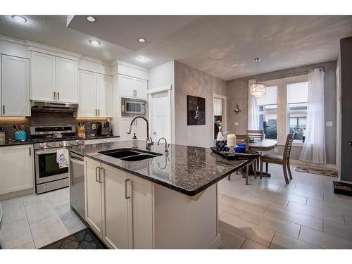 1186 Coopers Drive Sw, Airdrie, AB - Indoor Photo Showing Kitchen With Double Sink With Upgraded Kitchen