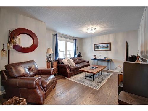 1186 Coopers Drive Sw, Airdrie, AB - Indoor Photo Showing Living Room