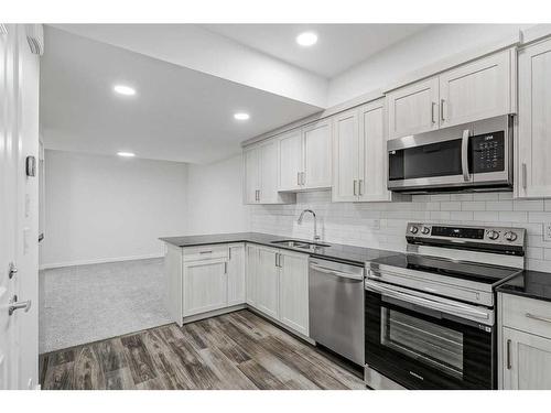 17 Creekstone Place Sw, Calgary, AB - Indoor Photo Showing Kitchen With Stainless Steel Kitchen With Upgraded Kitchen