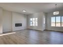 206 Blackstone Road, Balzac, AB  - Indoor Photo Showing Living Room With Fireplace 