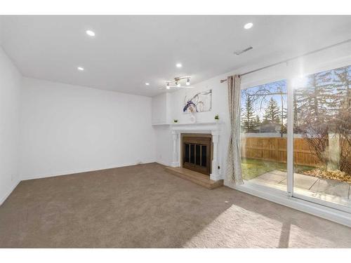 65-1012 Ranchlands Boulevard Nw, Calgary, AB - Indoor With Fireplace