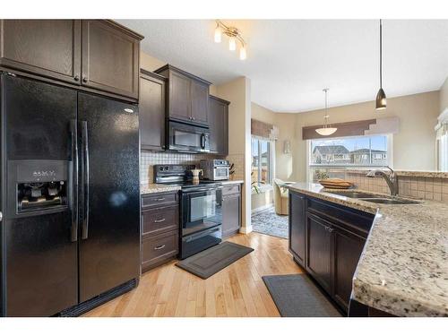 111 Sage Hill Green Nw, Calgary, AB - Indoor Photo Showing Kitchen With Double Sink