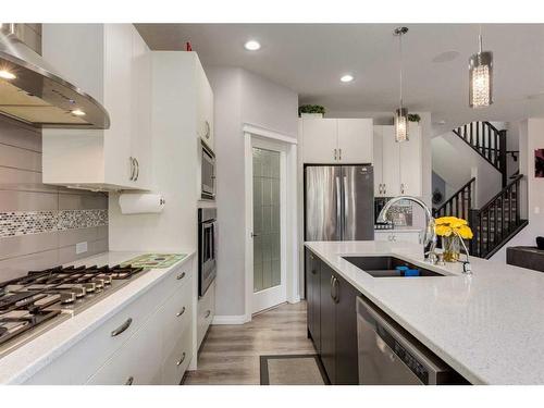 102 Hillcrest Heights Sw, Airdrie, AB - Indoor Photo Showing Kitchen With Stainless Steel Kitchen With Double Sink With Upgraded Kitchen