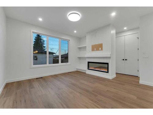 7106 36 Avenue Nw, Calgary, AB - Indoor Photo Showing Other Room With Fireplace