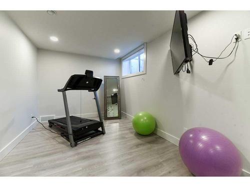 105 Trasimeno Crescent Sw, Calgary, AB - Indoor Photo Showing Gym Room