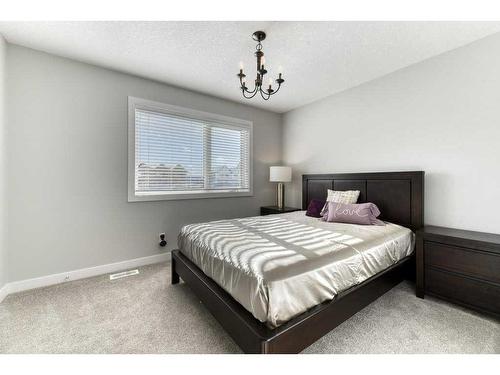 105 Trasimeno Crescent Sw, Calgary, AB - Indoor Photo Showing Bedroom