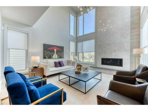 105 Trasimeno Crescent Sw, Calgary, AB - Indoor Photo Showing Living Room With Fireplace