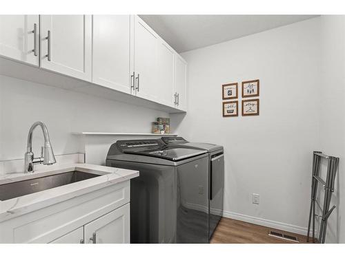 50 Crystalridge Crescent, Okotoks, AB - Indoor Photo Showing Laundry Room